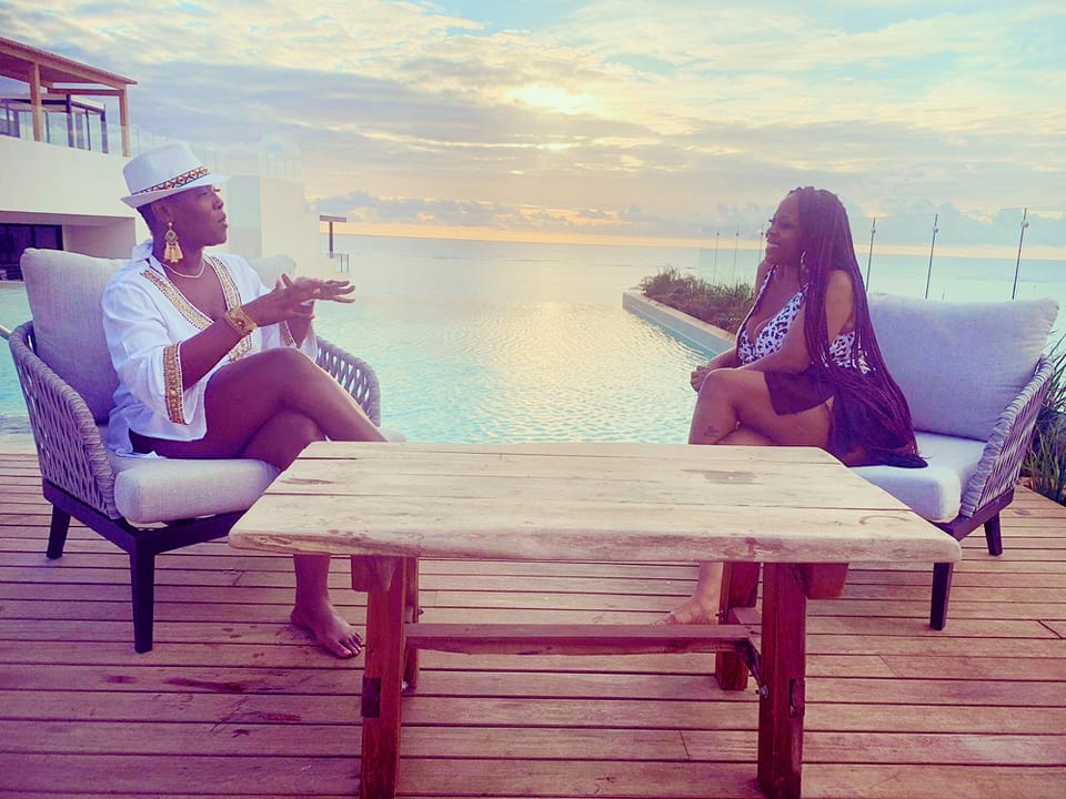 Dee Williams, Audacionaire and Chief Staffingpreneur and Latasha Harris, Staffingpreneur Coach talk business in Mexico on the rooftop over the sunset